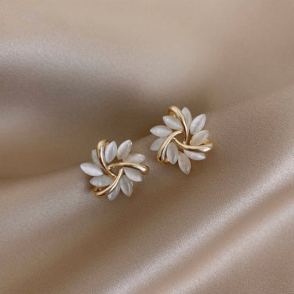 Gold hoop earrings with opal flowers