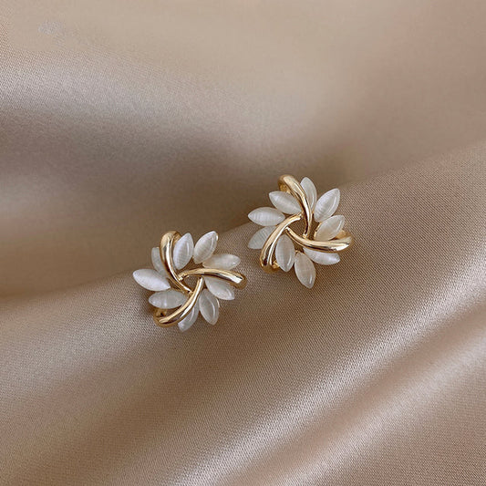 Gold hoop earrings with opal flowers