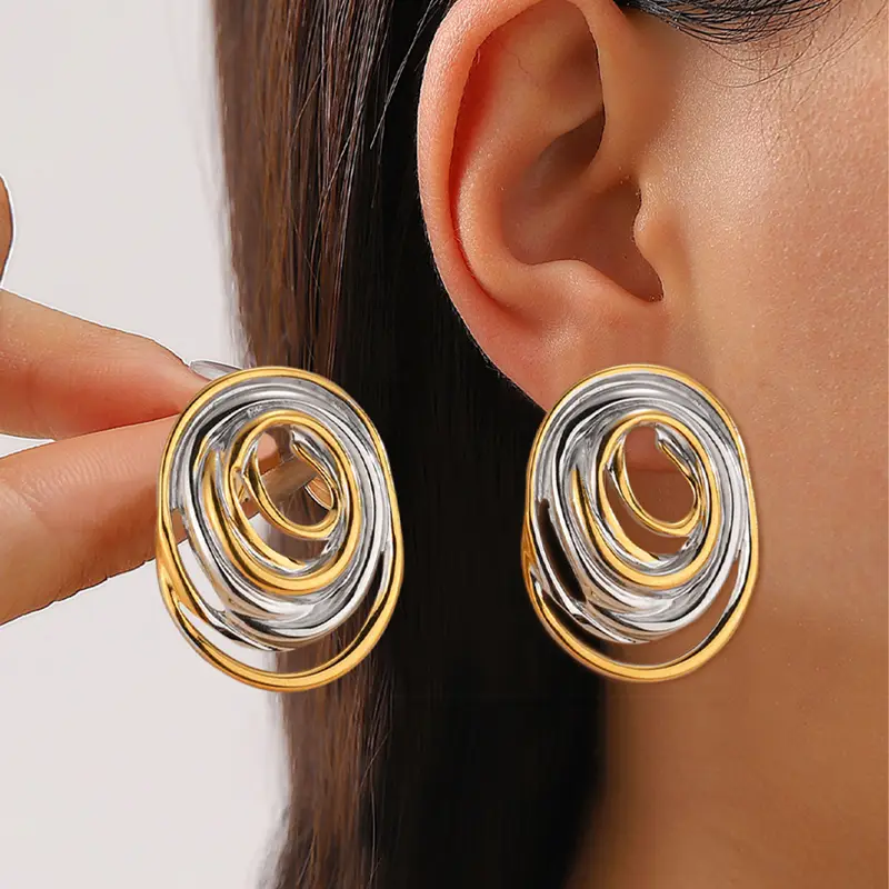 Vintage earrings in gold and silver tone material