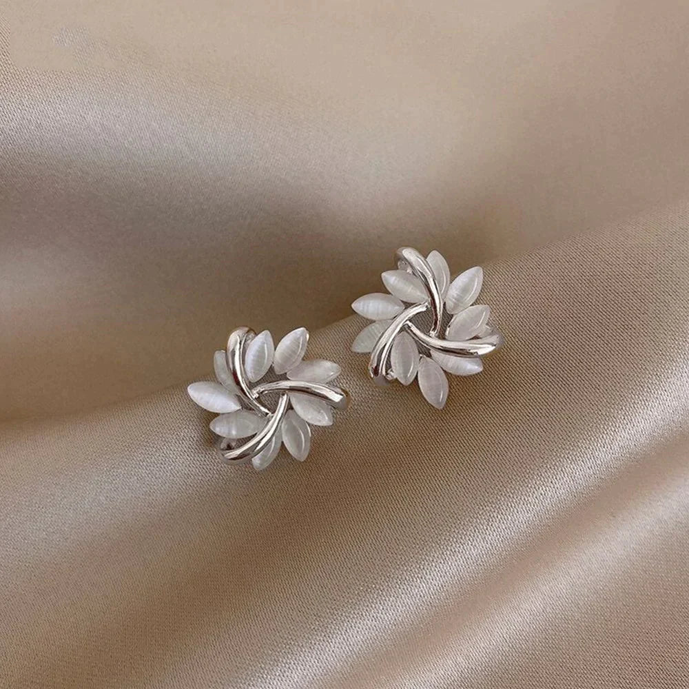 Gold hoop earrings with opal flowers