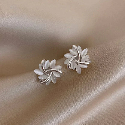 Gold hoop earrings with opal flowers